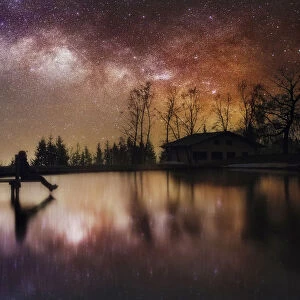 Milky way reflection in a small lake of the central Appennines, Tuscany, Italy