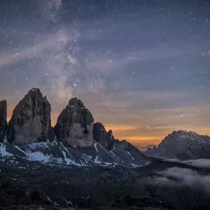 The Milky Way with its stars appear in a summer night on the Three Peaks of Lavaredo The Milky Way with its stars appear in a summer night on the Three Peaks of Lavaredo