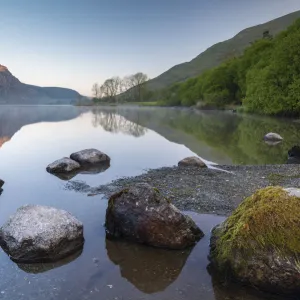 Mirror reflections at dawn on Llyn Cwellyn in Snowdonia National Park, Wales, UK. Spring