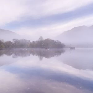 Misty autumn morning on Ullswater in the Lake District, Cumbria, England. Autumn