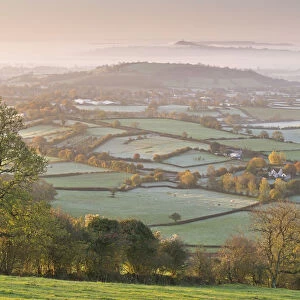 Misty Glastonbury Tor and the Somerset Levels from the Mendip Hills, Somerset, England
