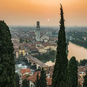 Misty sunset and city skyline, Verona, Veneto, Italy