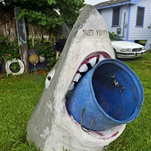 Model of a Great White Shark holds a rubbish bin in its mouth, Treasure Cay, Abacos