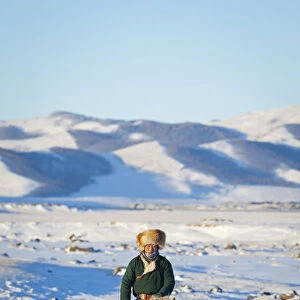 Mongolia, Ovorkhangai, Orkkhon Valley. A man approaches on horseback at sunrise