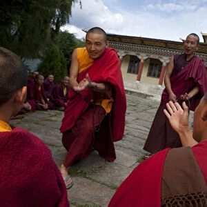 Monks debating at the Sangha of the Kharchu Monastery in Chamkar, Bhutan
