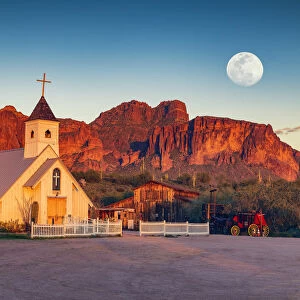 Moon over Elvis Memorial Chapel & Superstition Mountains, near Phoenix, Arizona, USA