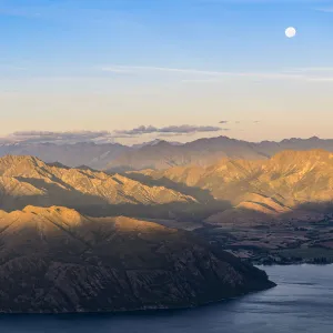 Moon over Lake Wanaka at sunset shot from Roys Peak track