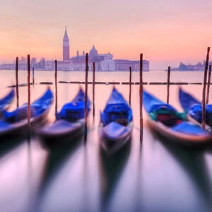 Moored gondolas with San Giorgio Maggiore in the background at dawn, Venice, Veneto