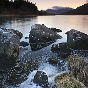 Mount Snowdon at dusk viewed from the rocky shores of Llynnau Mymbyr, Snowdonia National