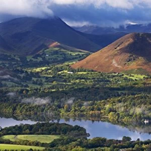 Mountains and woodland form a backdrop to Derwent Water in the Lake District, Cumbria, England