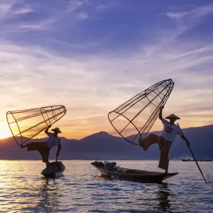 Myanmar (Burma), Shan State, Inle Lake, local fishermen at sunset Myanmar (Burma), Shan State, Inle Lake, local fishermen at sunset