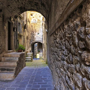 Narrow alley in the historic center of Castelvecchio Calvisio, Abruzzo, Italy