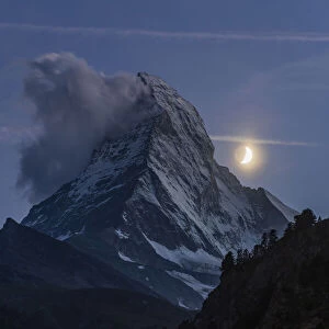 Night view of Matterhorn with crescent moon, Zermatt, Valais, Switzerland