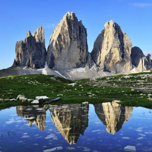 North walls of the Three Peaks reflected in a large puddle, Sexten Dolomites, Alta