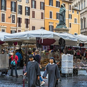 Nuns walking in Campo de Fiori square, Rome, Lazio, Italy