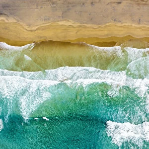 ocean waves crashing on the golden sand of Cofete Beach, Jandia, Fuerteventura
