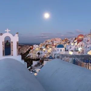Oia at dawn with moon in the sky, Santorini, Cyclades Islands, Greece, Europe