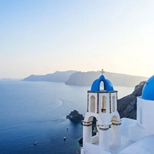 Oia, Santorini, Cyclades, Greece; The famous blue domes of the churches of Oia