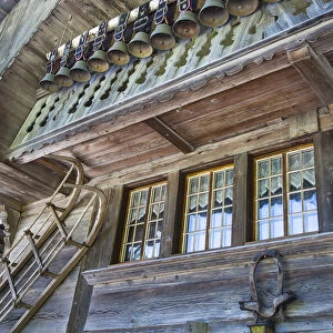 Old chalet with display of cow bells, in the Emmental Valley, Berner Oberland, Switzerland