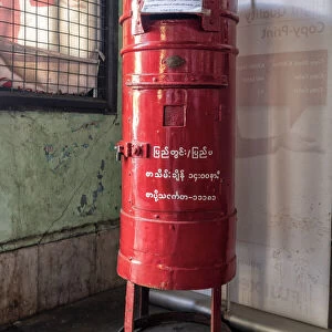 Old colonial style red letterbox in post office in Yangon, Myanmar