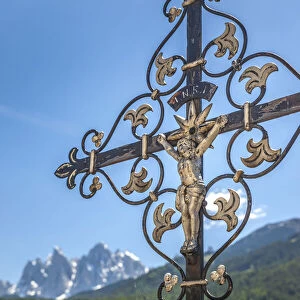 Old grave cross in the cemetery of St. Peter in Villnoss Valley, South Tyrol, Italy