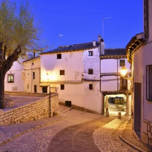 The old houses dating back to the 15 th century at the Plaza Mayor of Chinchon at dusk