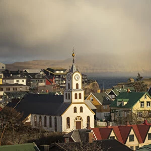 The old part of Torshavn at sunset. In the background the island of Nolsoy. Streymoy, Faroe Islands