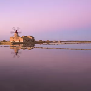 Old windmill in the Marsala Salt Pans, Trapani, Sicily, Italy