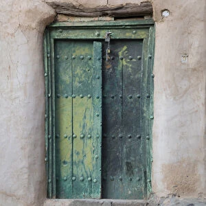 Oman, Ad Dakhiliyah region, Al Hamra, Misfat Al Abreen, Old green, wooden door in