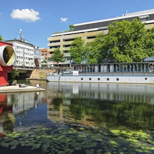 One-Man-House (Architect Thomas Schutte) and show boat on Neckar River, Heilbronn, Baden-Wurttemberg, Germany