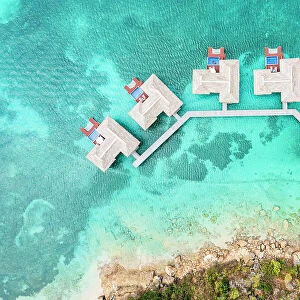 Overhead view of luxury tourist resort with overwater bungalows in the crystal water of Caribbean Sea, Antigua, West Indies