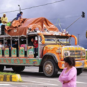 Overloaded bus on the Panamericana Highway, near Popayan, Colombia, South America