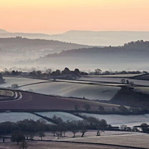 Overlooking frost and mist covered countryside at dawn near the village of Silverton