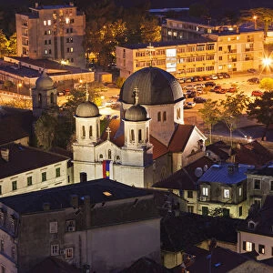 Panorama of Kotor at night with a detail on the Orthodox Church of St