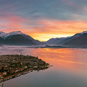 Panoramic of Lake Como and the lakeshore town of Domaso at sunrise, aerial view