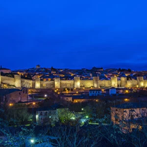 Panoramic night view of the medieval city walls illuminated, Avila, Castile and Leaon