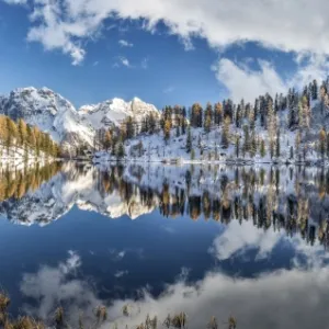 Panoramic shot of the Lake Malghette in autumn with Dolomites of Brenta in the background