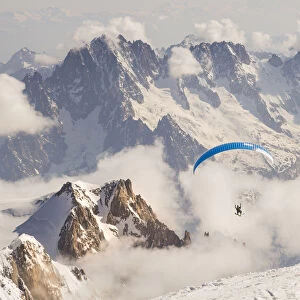 Paragliding from the summit of Mount Balnc after rising it by ski mountaneering