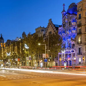 Passeig de Gracia avenue adorned with Christmas lights and Casa Battlo, Barcelona