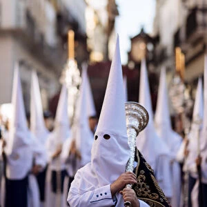 Penitents of Los Negritos Brotherhood taking part in processions during Semana