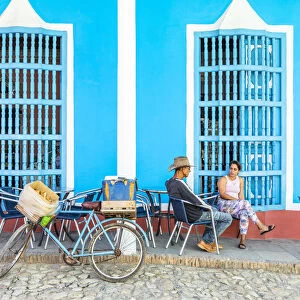 People sat outside a restaurant in Trinidad, Sancti Spiritus, Cuba