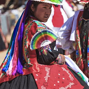 People wearing traditional costumes on Isla Taquile on the Peruvian side of Lake Titicaca