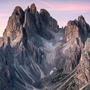 One person admires the Cadini di Misurina mountain range, Auronzo di Cadore, Belluno