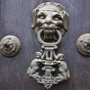 Peru. A knocker decorates the wooden doors of Lima Cathedral. Built 1555 but almost destroyed by 1746 s