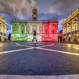 Piazza del Campidoglio with Palazzo Senatorio illuminated with the colors of the Italian