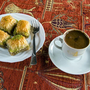Plate with traditional baklava Turkish sweet and cup of Turkish coffee