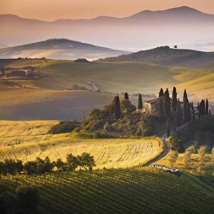 Podere Belvedere, San Quirico d Orcia, Tuscany, Italy. Sunrise over the farmhouse