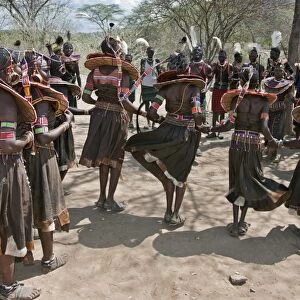Pokot men and women dancing to celebrate an Atelo ceremony. The Pokot are pastoralists speaking a Southern