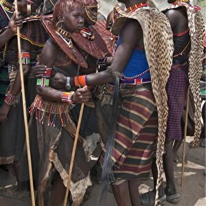 Pokot men, women and girls dancing to celebrate an Atelo ceremony. The Pokot are pastoralists speaking a Southern