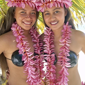 Polynesian Girls Dressed in Traditional Costume with Leis